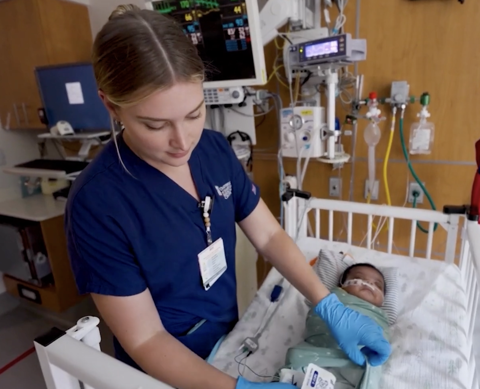Nurse attends to newborn baby